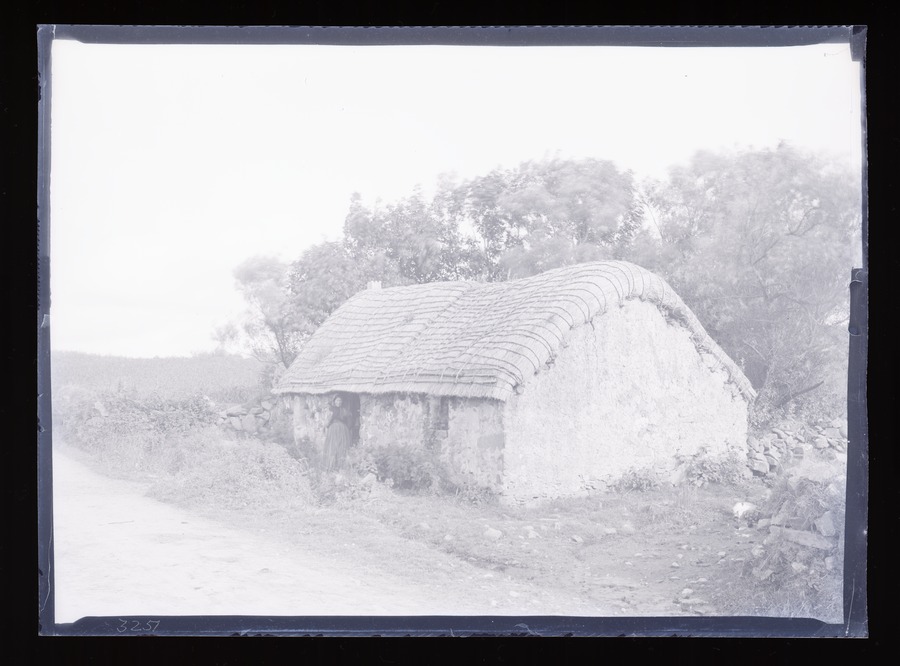 Killybegs, cottage, figures and woman Image credit Leeds University Library