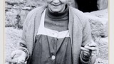 Mrs Jane Calvert, Low Wood Farm, Pateley Bridge, holding her mother's knitting stick and knitting belt which is Scottish. Image used for one of the photographic illustrations in "Dales Memories" (1986), plate 85