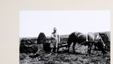 J.Atkinson leading peats with a coup cart to West End, Lunds, upper Wensleydale. Some peats are drying on the ground and others have been built into conical stacks (1936). Reproduced in "Yorkshire Album" (1988), plate 152.