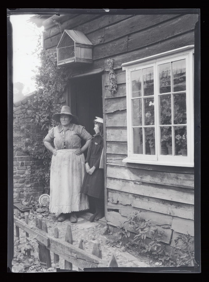 Lavenham, Woman at cottage door © University of Leeds