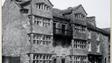 Olive Holliday and Eva Johnson on a walking tour, passing by Askrigg Old Hall. Photograph taken by MH c.1926. The Old Hall was burnt down in 1935. cp.drawing on page 100 of "Yorkshire Village" (1953)