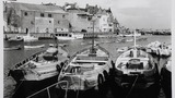 Bridlington Harbour, showing cobles in the foreground. Image originally used as one of the photographic illustrations in "Getting to Know Yorkshire" (1964), plate 16 below.(a second copy)