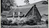 Oak Crag, Farndale, a renovated and altered medieval long house; 58 feet long by 23 feet wide. Three pairs of crucks. The 'dovecot' windows and thatch are recent. Image used for one of the photographic illustrations in "Life in the Moorlands of North-East