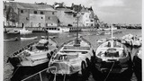 Bridlington Harbour, showing cobles in the foreground. Image originally used as one of the photographic illustrations in "Getting to Know Yorkshire" (1964), plate 16, below